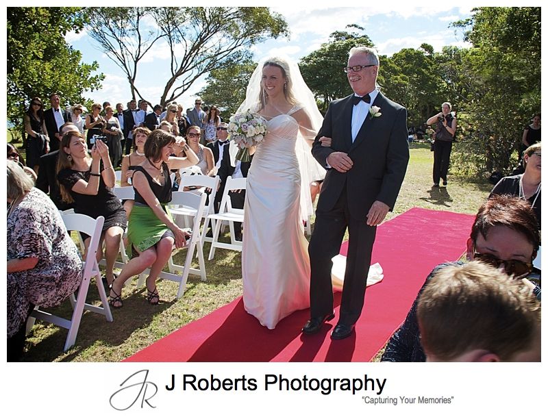 Bride walking down the aisle with her father - wedding photography sydney
